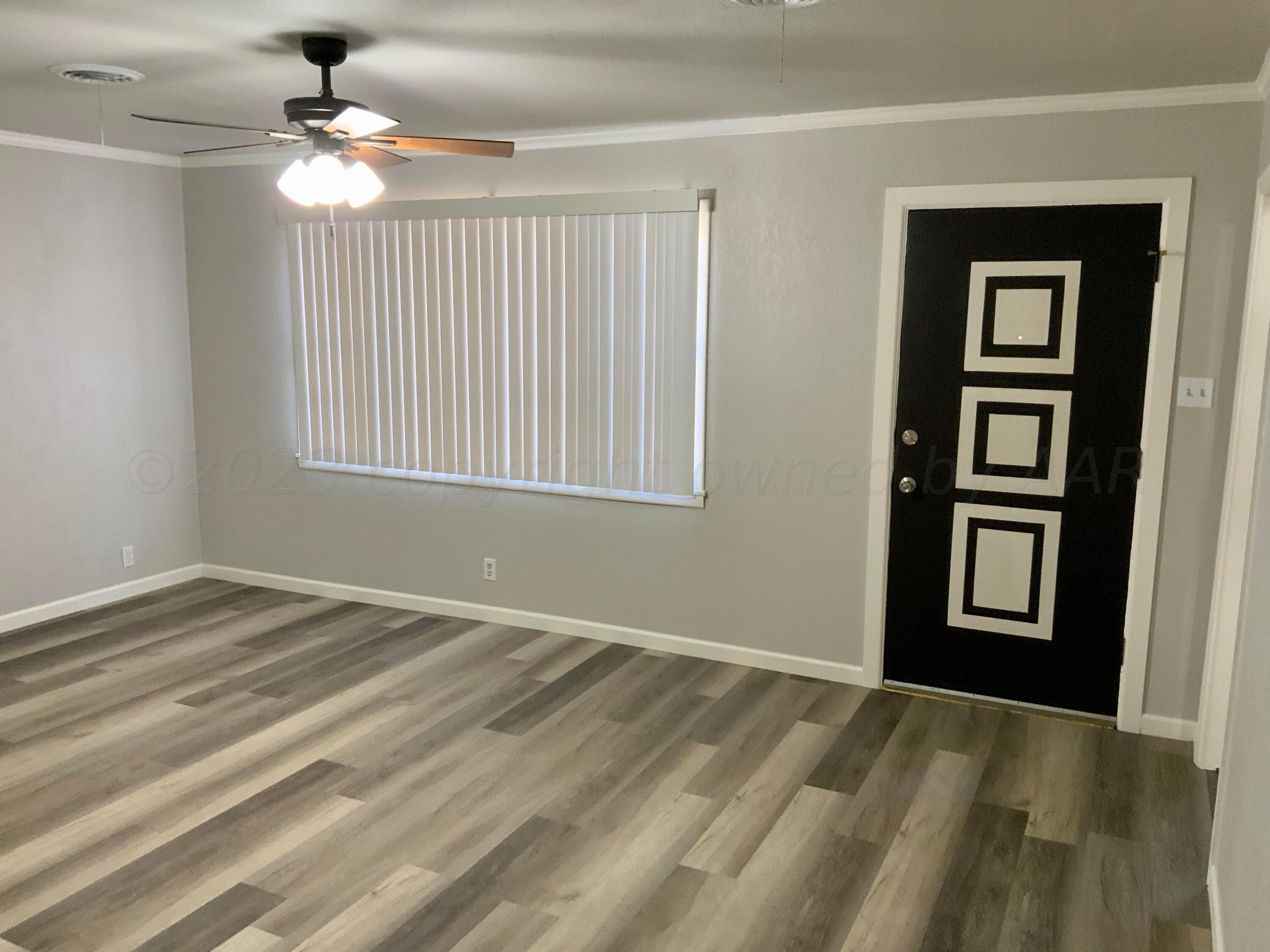 4616 South Rusk Street Amarillo, TX 79110 - Photo 3 of 25 a view of an empty room with a window