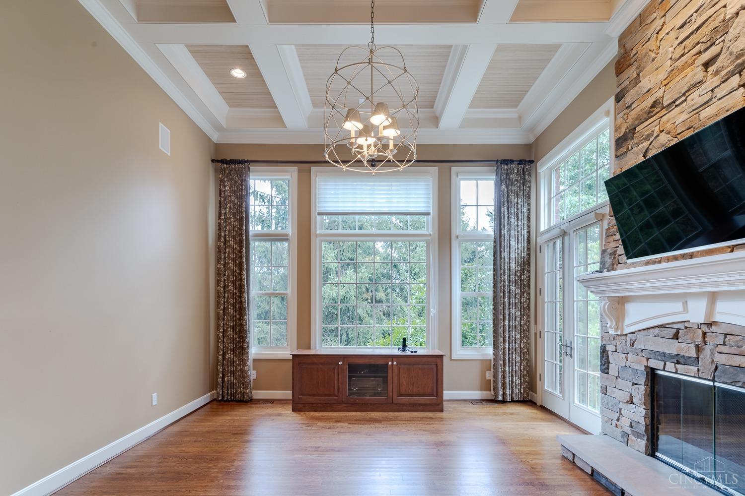 3548 Grandin Road Cincinnati, OH 45226 - Photo 14 of 47 Great Room (21' x 16') Amazing floor to ceiling windows and stunning coffered ceiling! The credenza holds sound system for house sound system (included with sale).