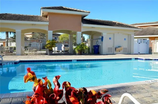 a front view of a house with outdoor seating