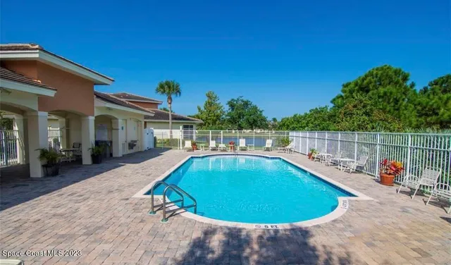 a view of a swimming pool with a lounge chairs