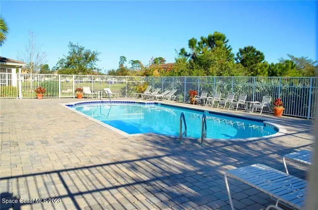 a view of a swimming pool with a lounge chairs