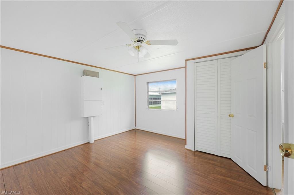 171 Grassy Key Lane, Unit 48 Naples, FL 34114 - Photo 11 of 19 a view of an empty room with a window