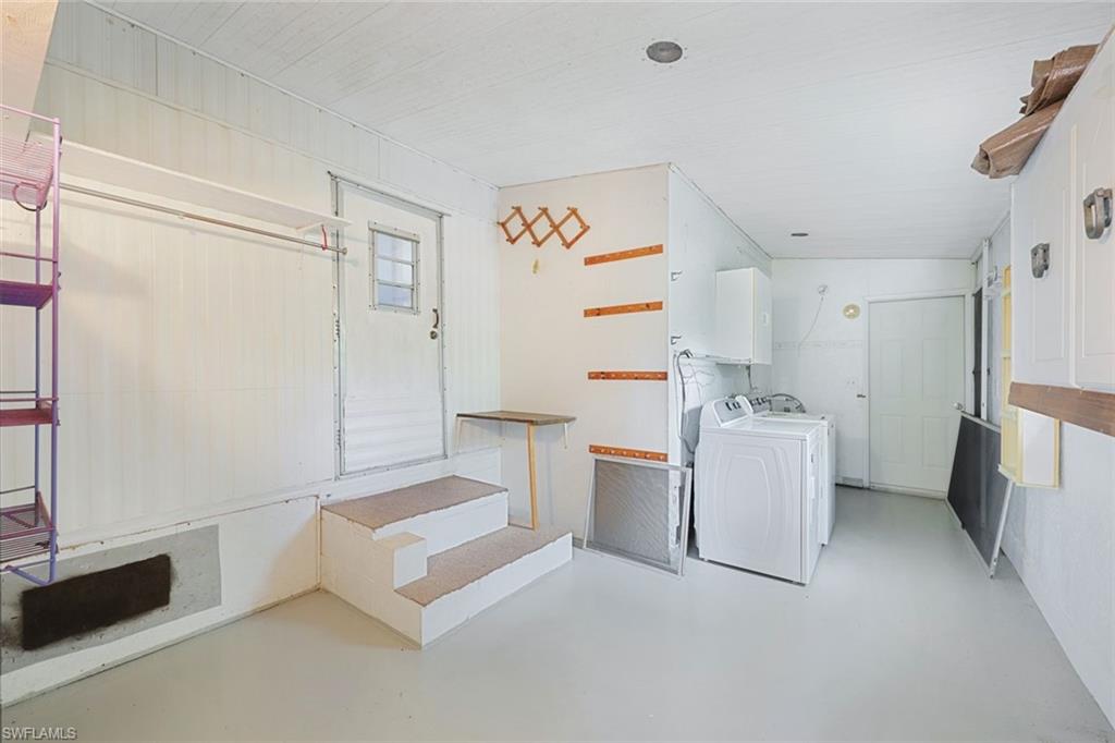 171 Grassy Key Lane, Unit 48 Naples, FL 34114 - Photo 13 of 19 a view of utility room and closet