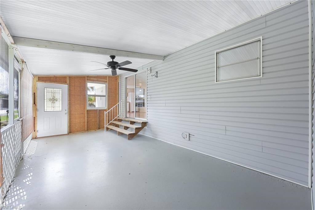 171 Grassy Key Lane, Unit 48 Naples, FL 34114 - Photo 14 of 19 an empty room with windows and closet