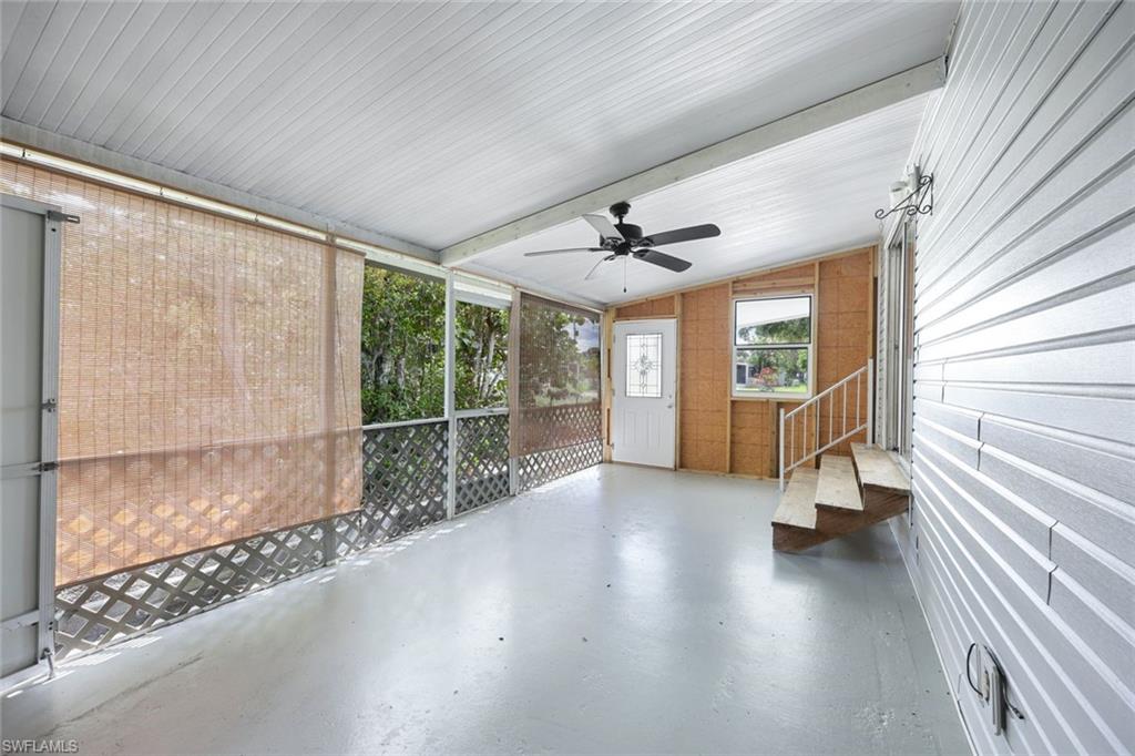 171 Grassy Key Lane, Unit 48 Naples, FL 34114 - Photo 15 of 19 a view of livingroom with hardwood floor and window