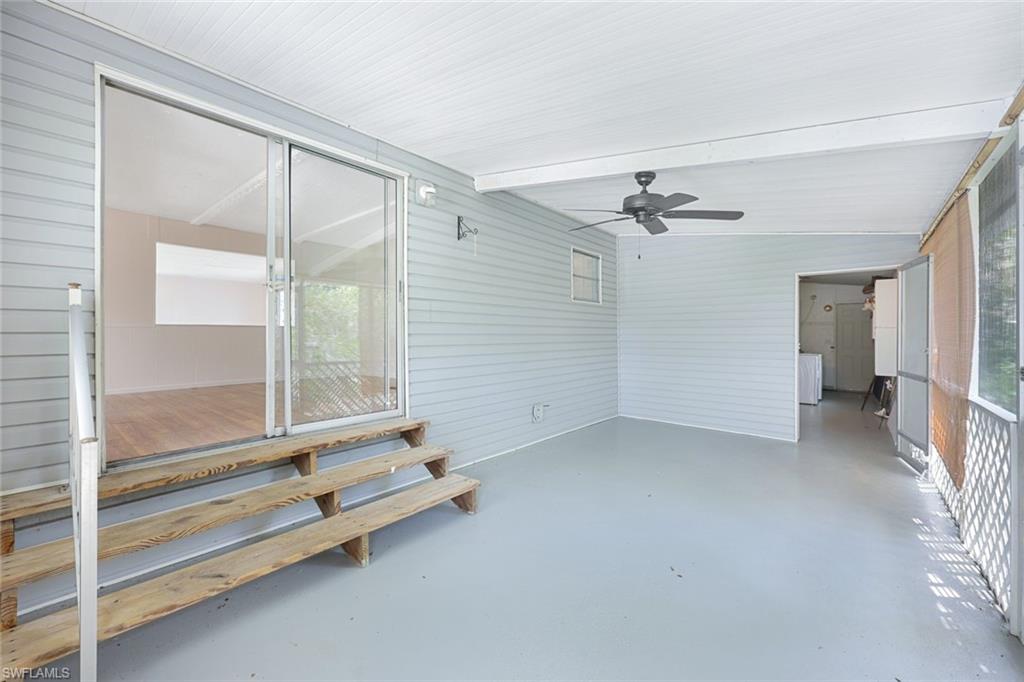 171 Grassy Key Lane, Unit 48 Naples, FL 34114 - Photo 16 of 19 wooden floor & ceiling fan in a room
