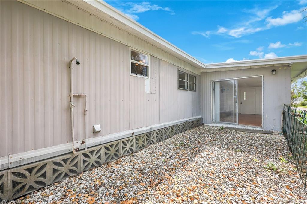 171 Grassy Key Lane, Unit 48 Naples, FL 34114 - Photo 17 of 19 a view of a wooden door