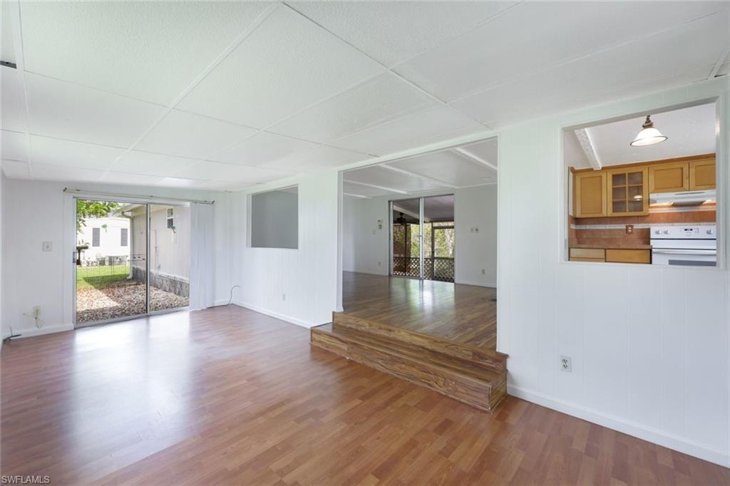 171 Grassy Key Lane, Unit 48 Naples, FL 34114 - Photo 2 of 19 a view of an entryway with wooden floors