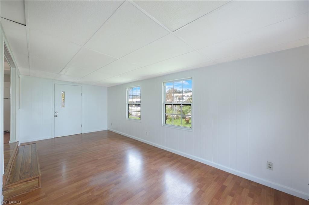 171 Grassy Key Lane, Unit 48 Naples, FL 34114 - Photo 3 of 19 an empty room with windows