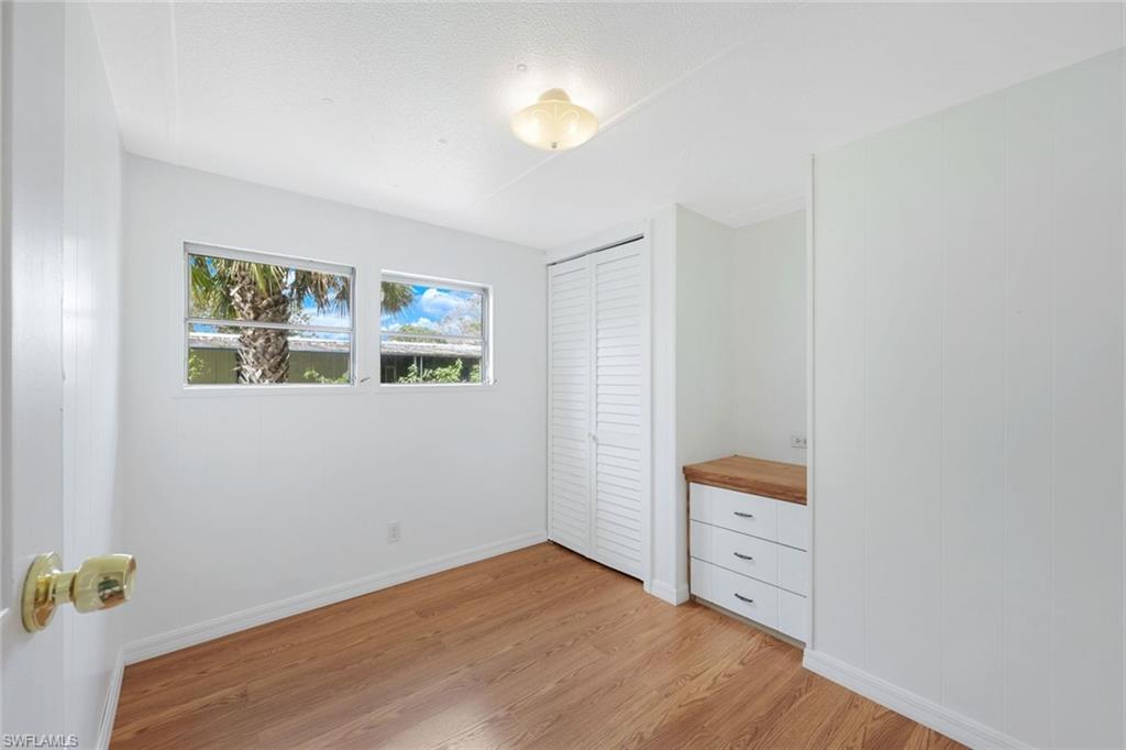 171 Grassy Key Lane, Unit 48 Naples, FL 34114 - Photo 9 of 19 a room with a bed and a window