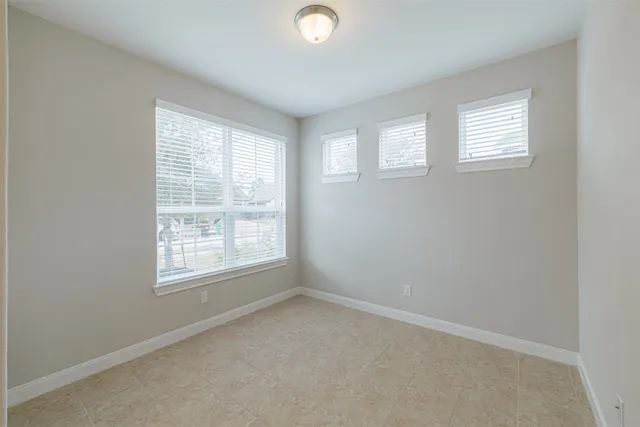 an empty room with windows