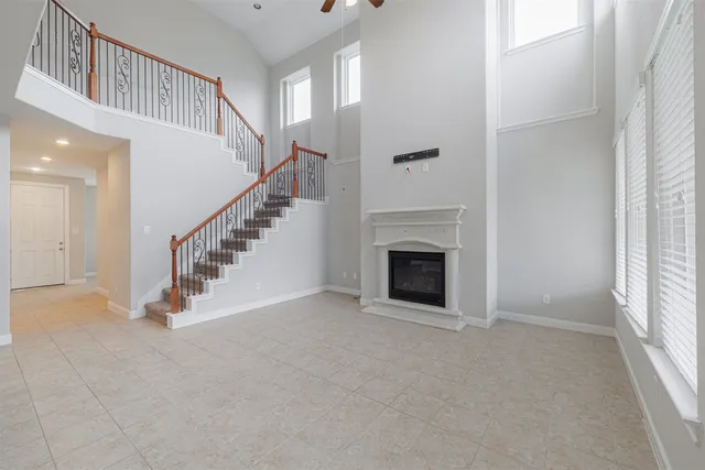 a view of an empty room with stairs