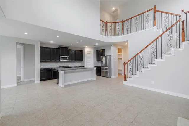 a view of kitchen with microwave and a stove top oven