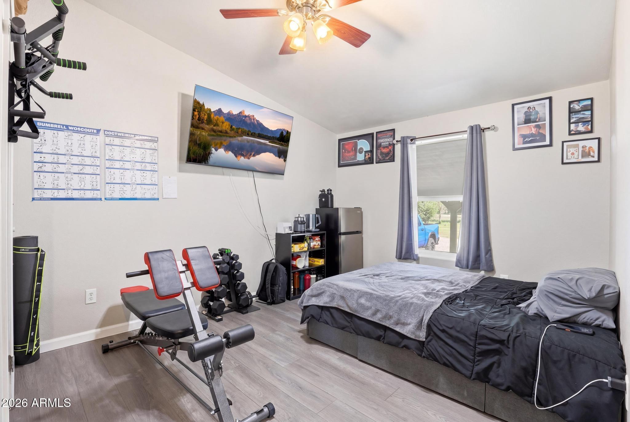 191 Cornerstone Way Payson, AZ 85541 - Photo 20 of 37 a bedroom with a bed and a chandelier