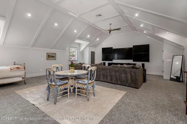 a view of a livingroom with furniture and a flat screen tv