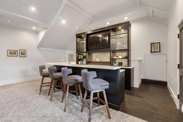 a kitchen with stainless steel appliances kitchen island granite countertop a sink and cabinets