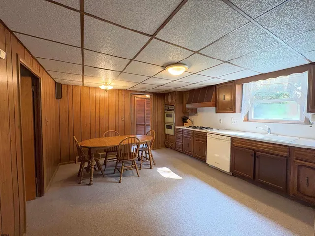 a view of a room with furniture and a window