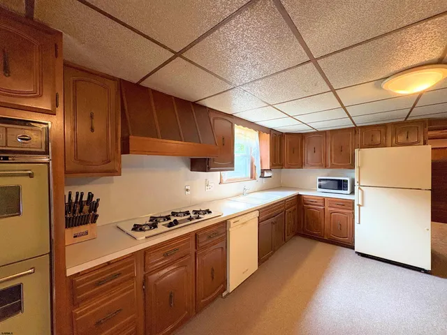 a bathroom with a sink mirror and vanity