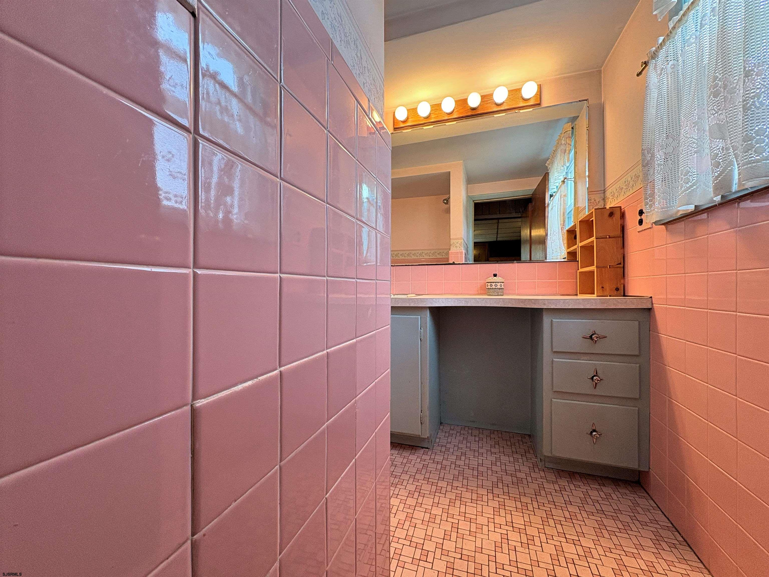 301 Broad Street Milmay, NJ 08330 - Photo 16 of 64 a bathroom with a sink and a mirror