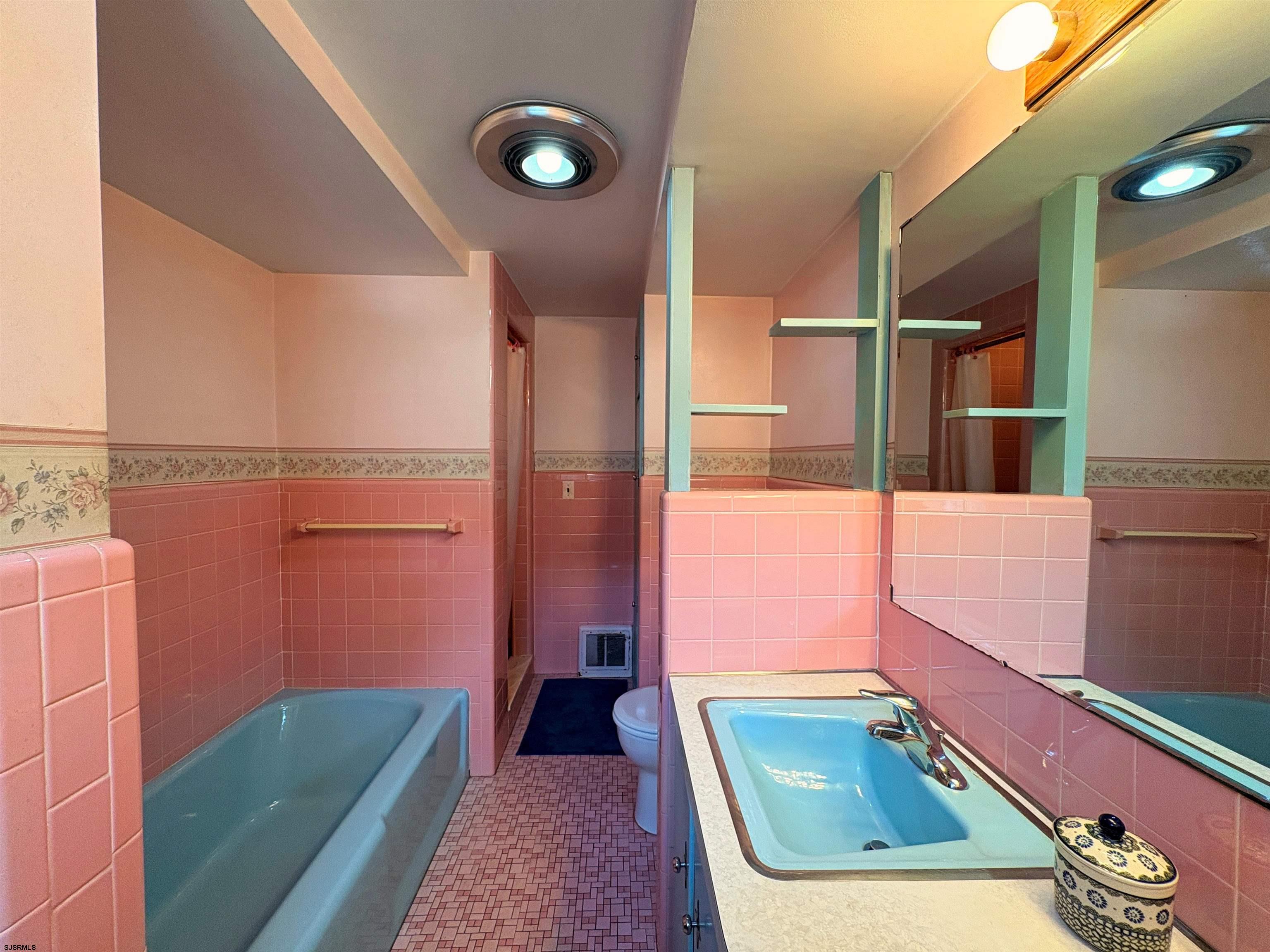 301 Broad Street Milmay, NJ 08330 - Photo 17 of 64 a bathroom with a sink mirror and vanity