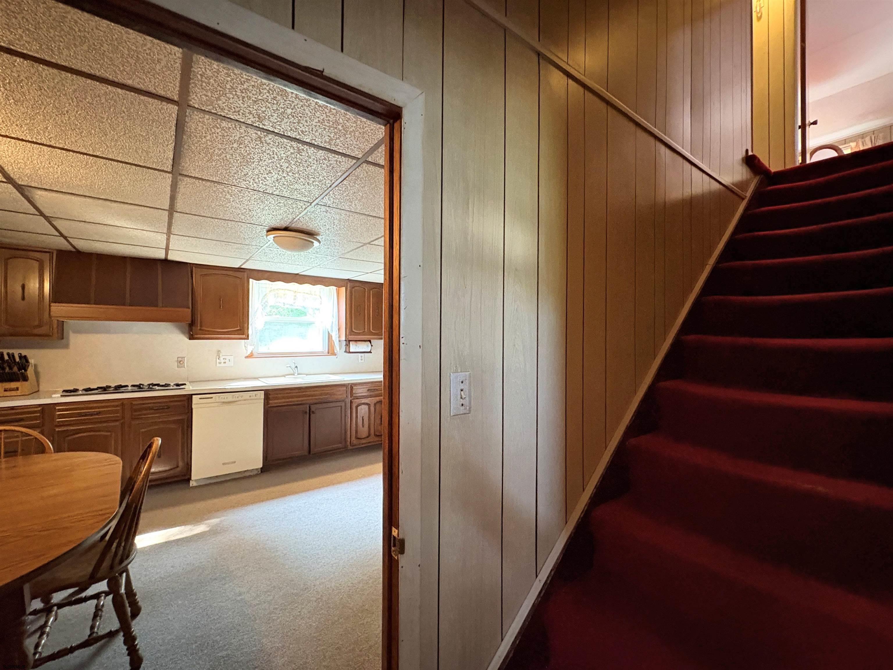 301 Broad Street Milmay, NJ 08330 - Photo 21 of 64 a kitchen with stainless steel appliances granite countertop a stove a sink and a refrigerator