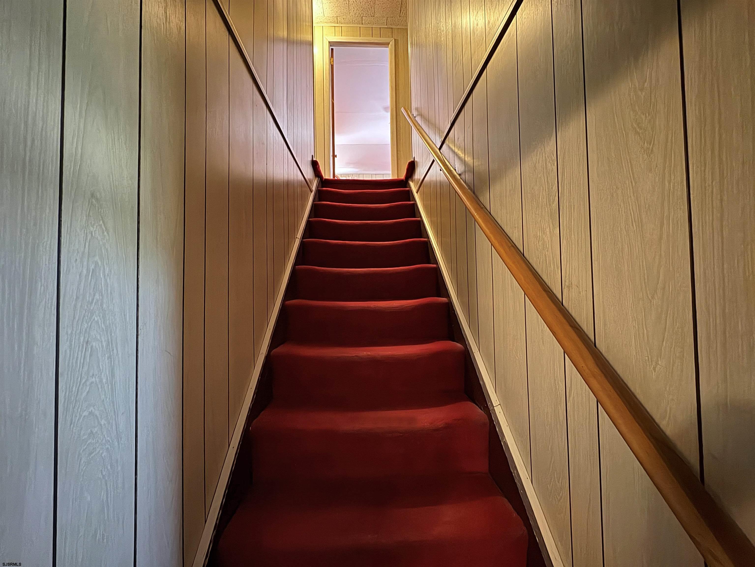301 Broad Street Milmay, NJ 08330 - Photo 22 of 64 a view of staircase with wooden floor and white walls