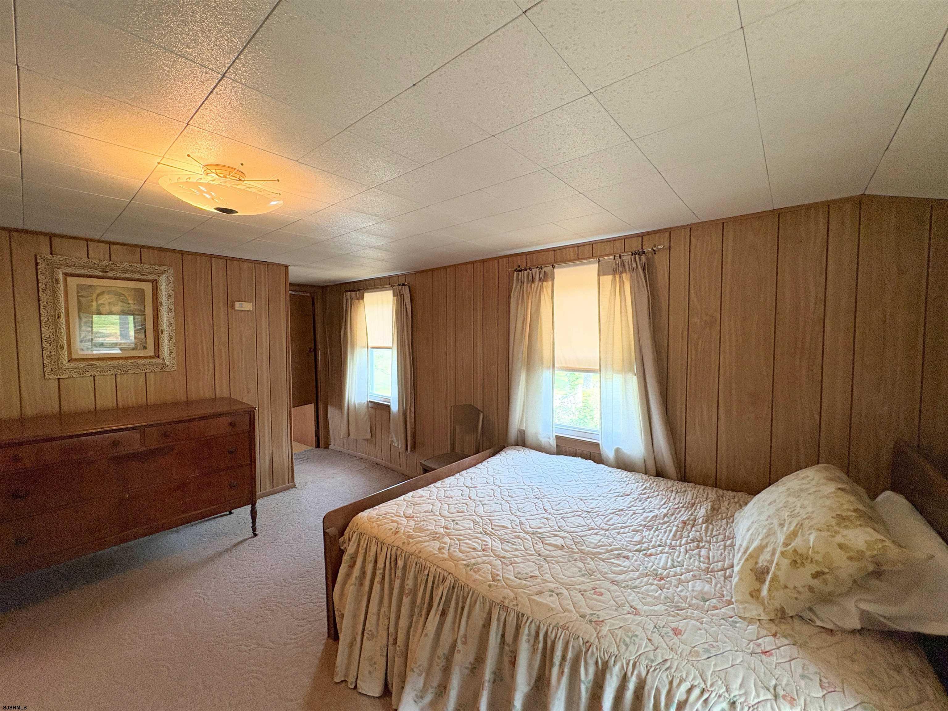 301 Broad Street Milmay, NJ 08330 - Photo 29 of 64 a bedroom with a large bed and a window