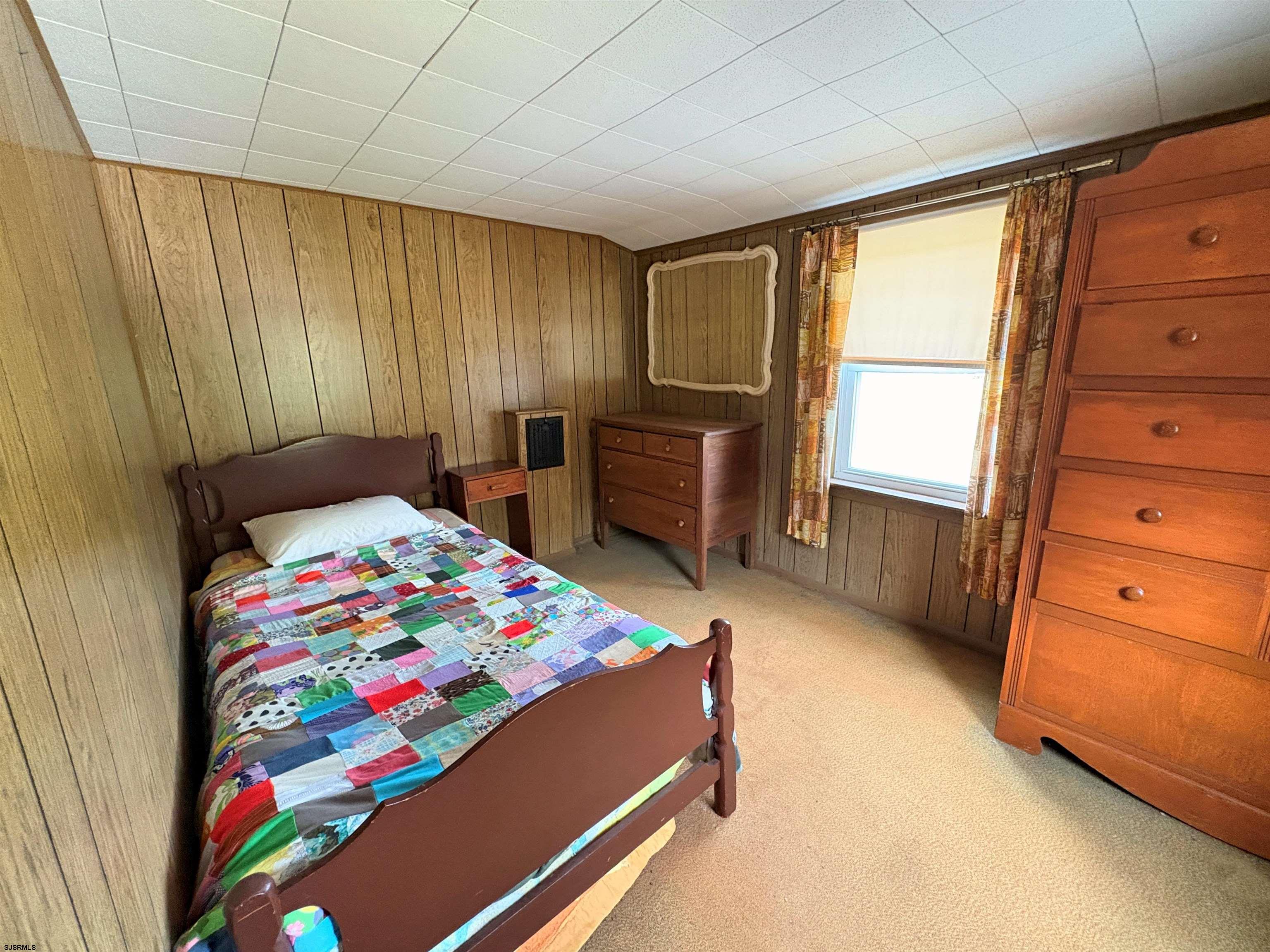 301 Broad Street Milmay, NJ 08330 - Photo 31 of 64 a bedroom with a bed and a dresser in it