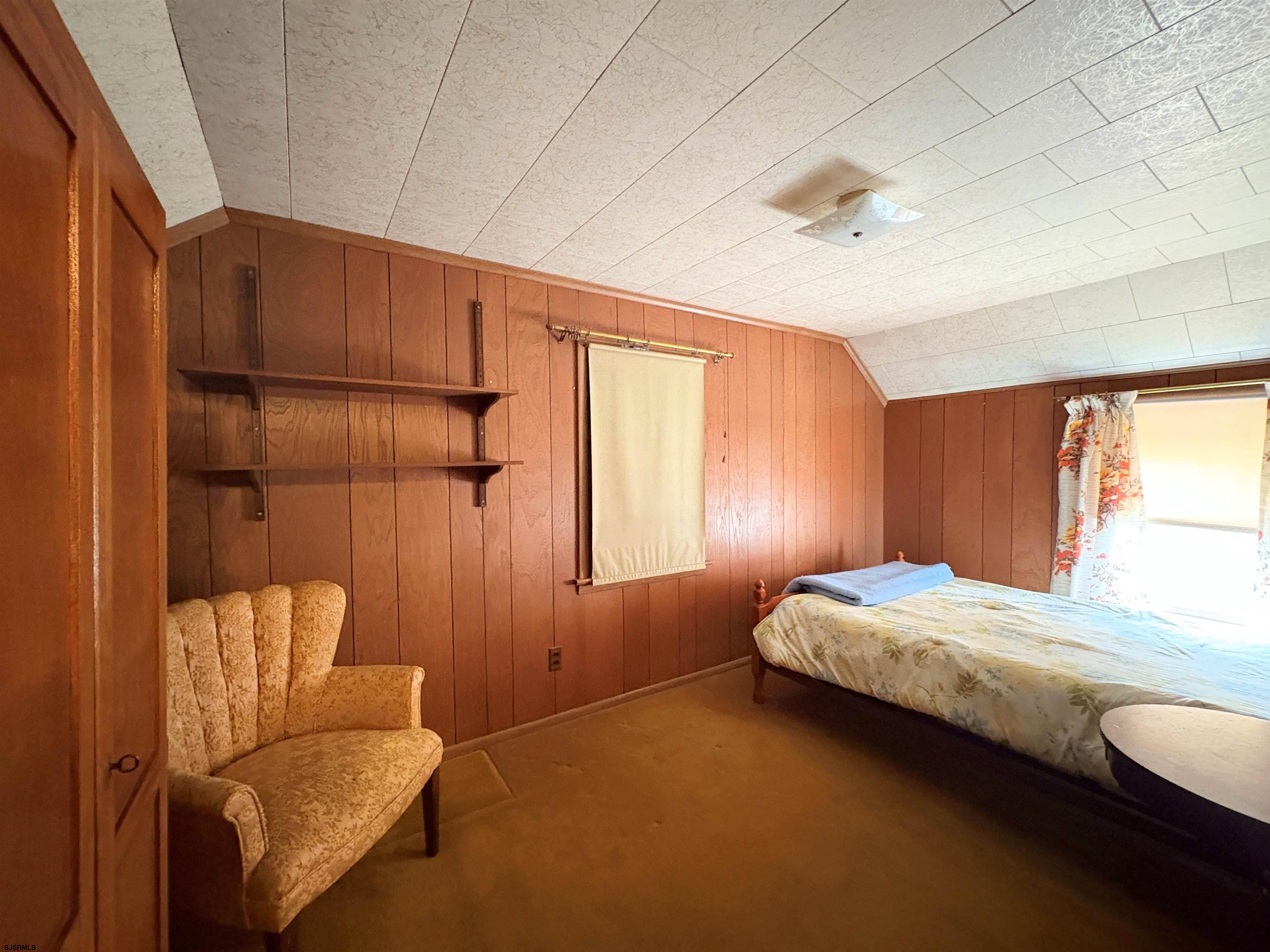 301 Broad Street Milmay, NJ 08330 - Photo 33 of 64 a bedroom with a bed and a couch