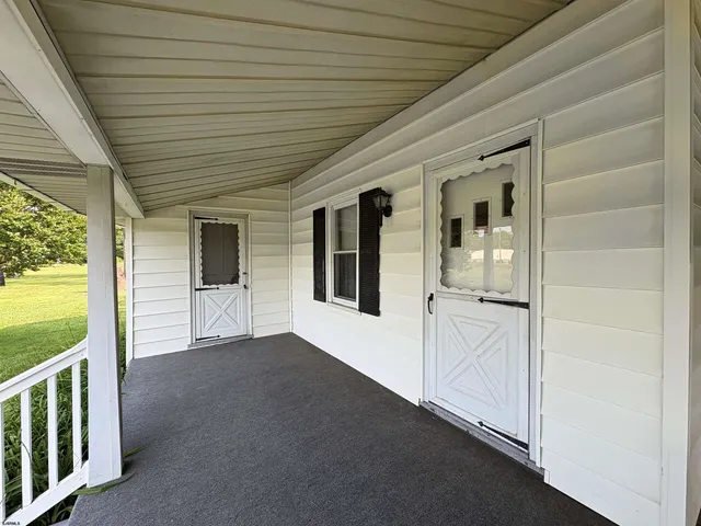 a view of a field with a tree