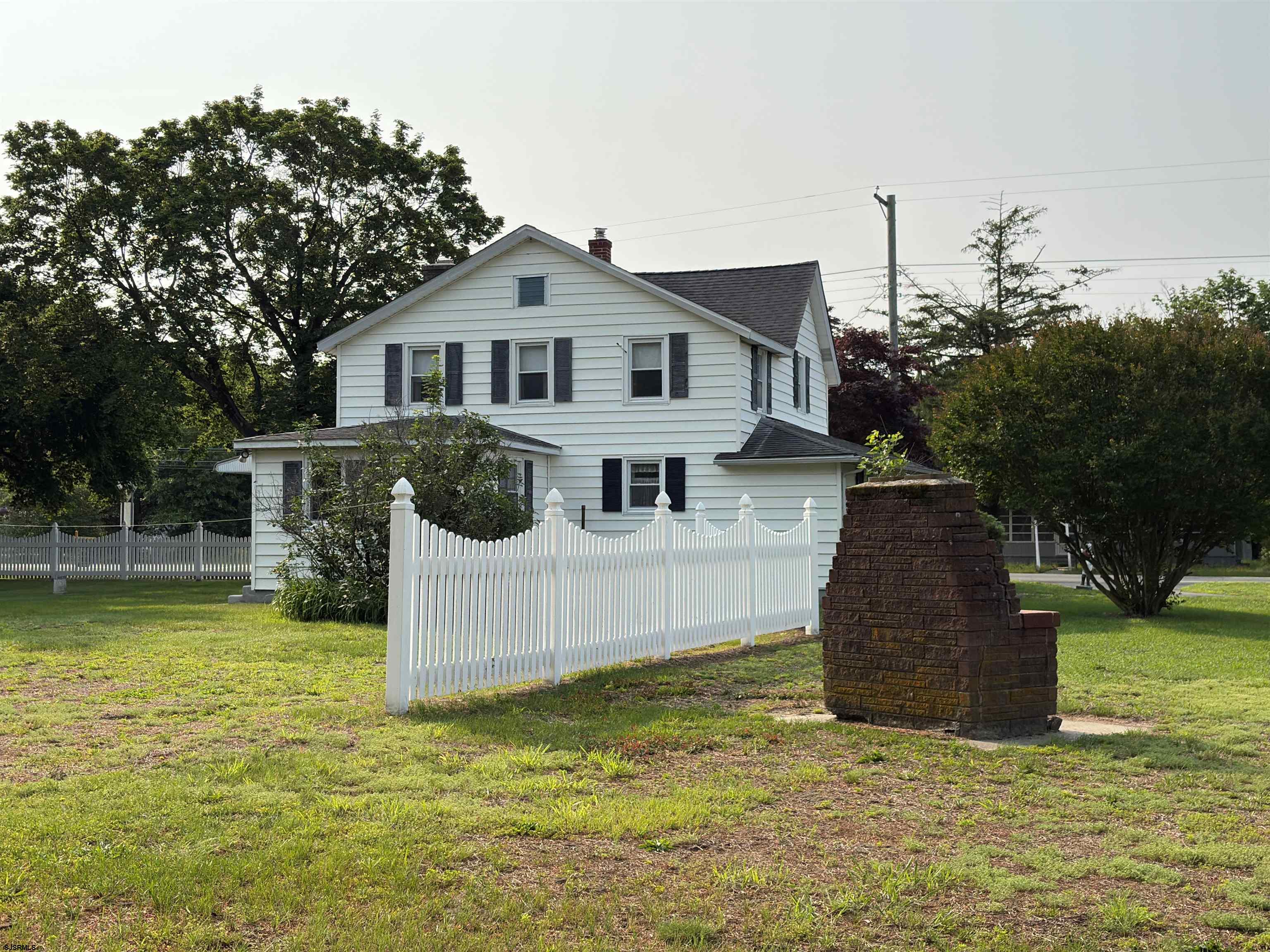 301 Broad Street Milmay, NJ 08330 - Photo 47 of 64 a front view of a house with garden