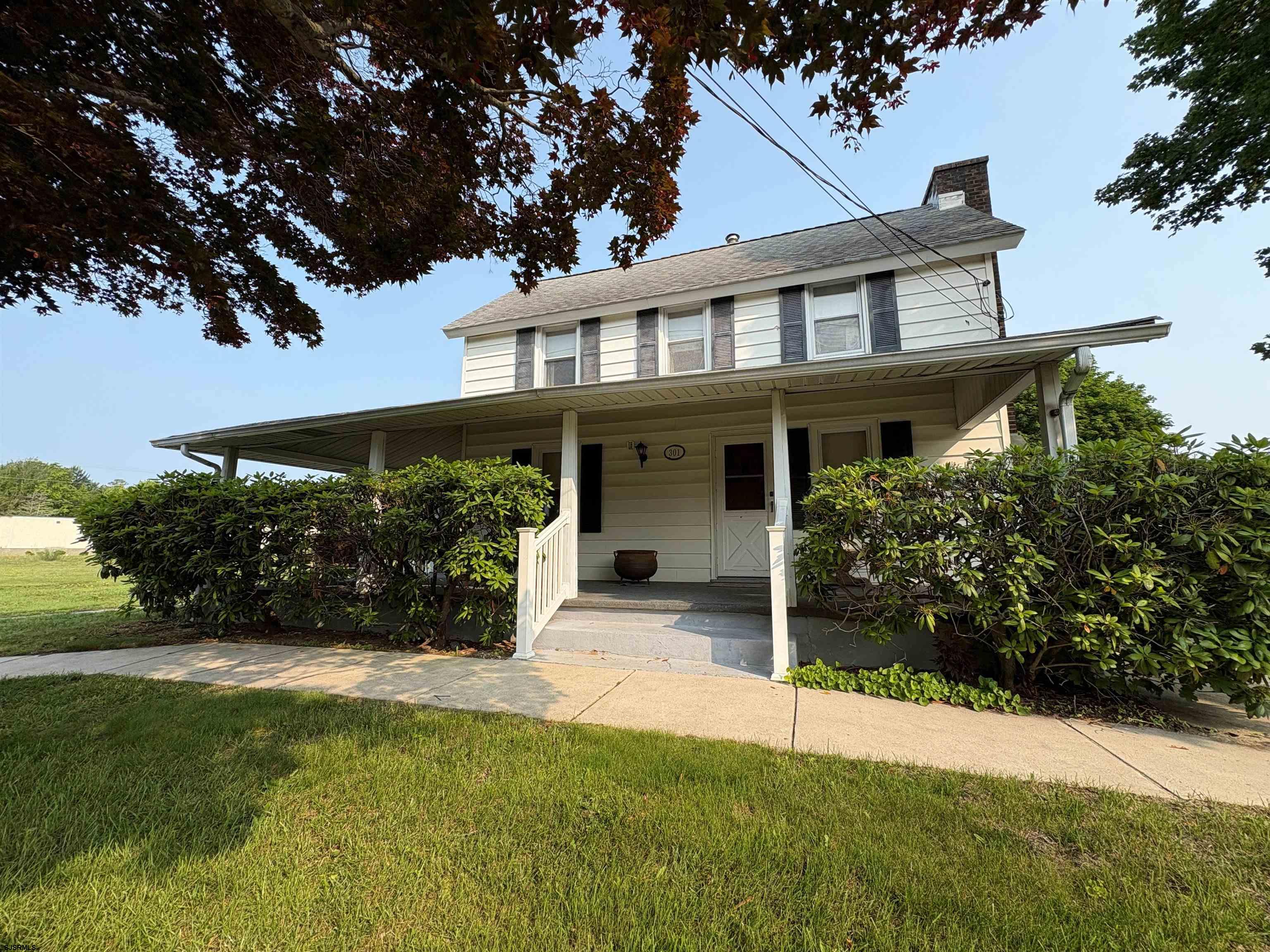 301 Broad Street Milmay, NJ 08330 - Photo 61 of 64 front view of a house with a yard