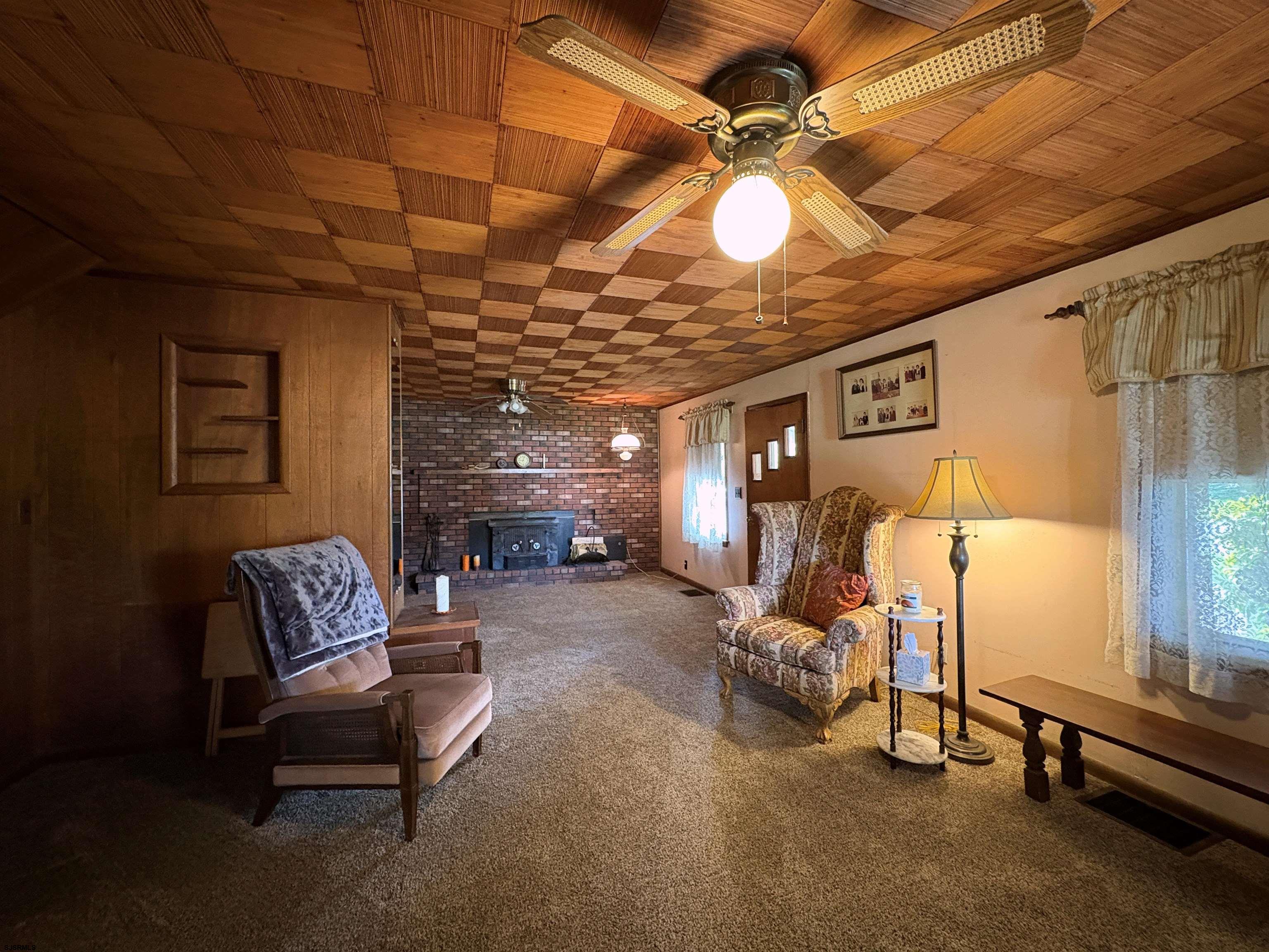 301 Broad Street Milmay, NJ 08330 - Photo 8 of 64 a living room with furniture and a chandelier