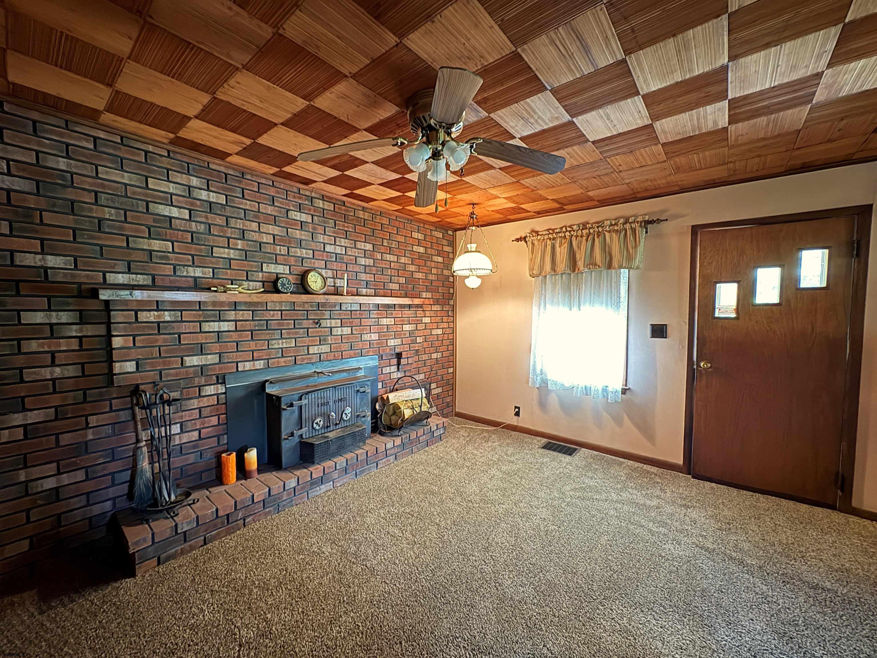 301 Broad Street Milmay, NJ 08330 - Photo 9 of 64 a view of empty room with fireplace