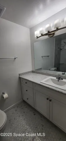 a bathroom with a toilet and a bathtub