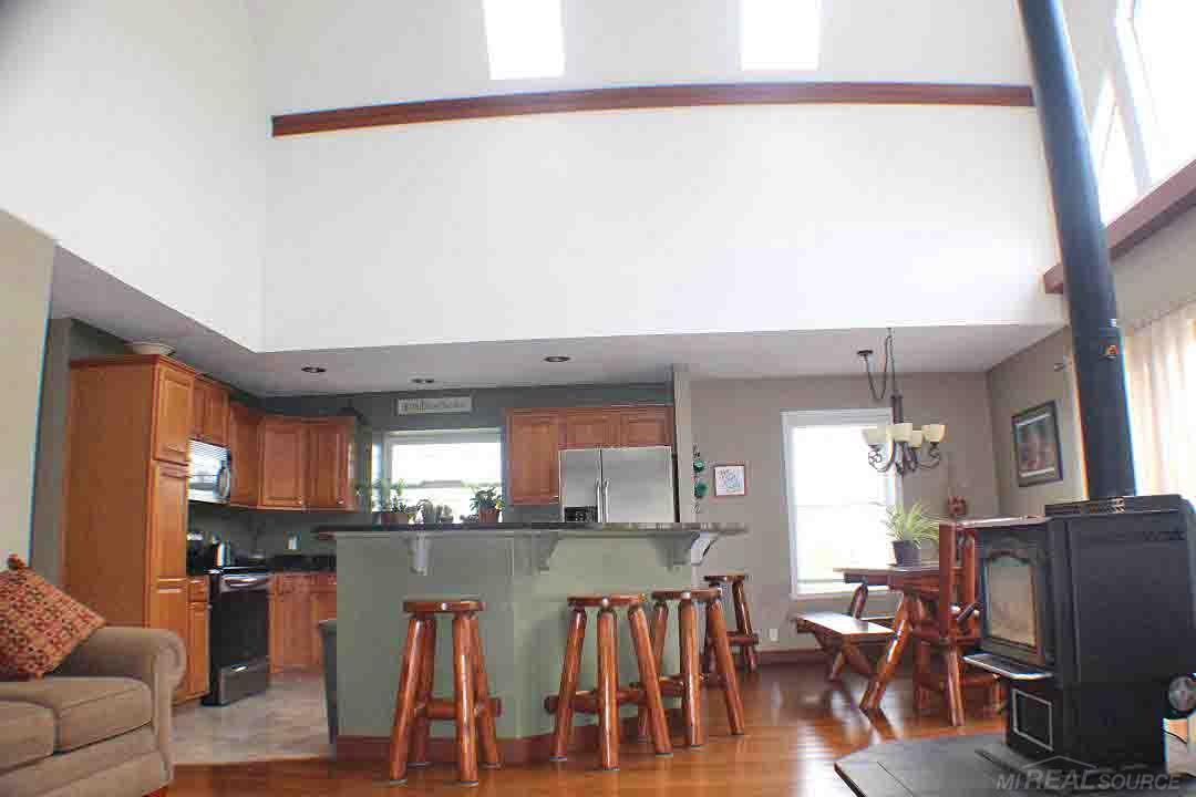 View from the living room into the kitchen and eat in dining room.