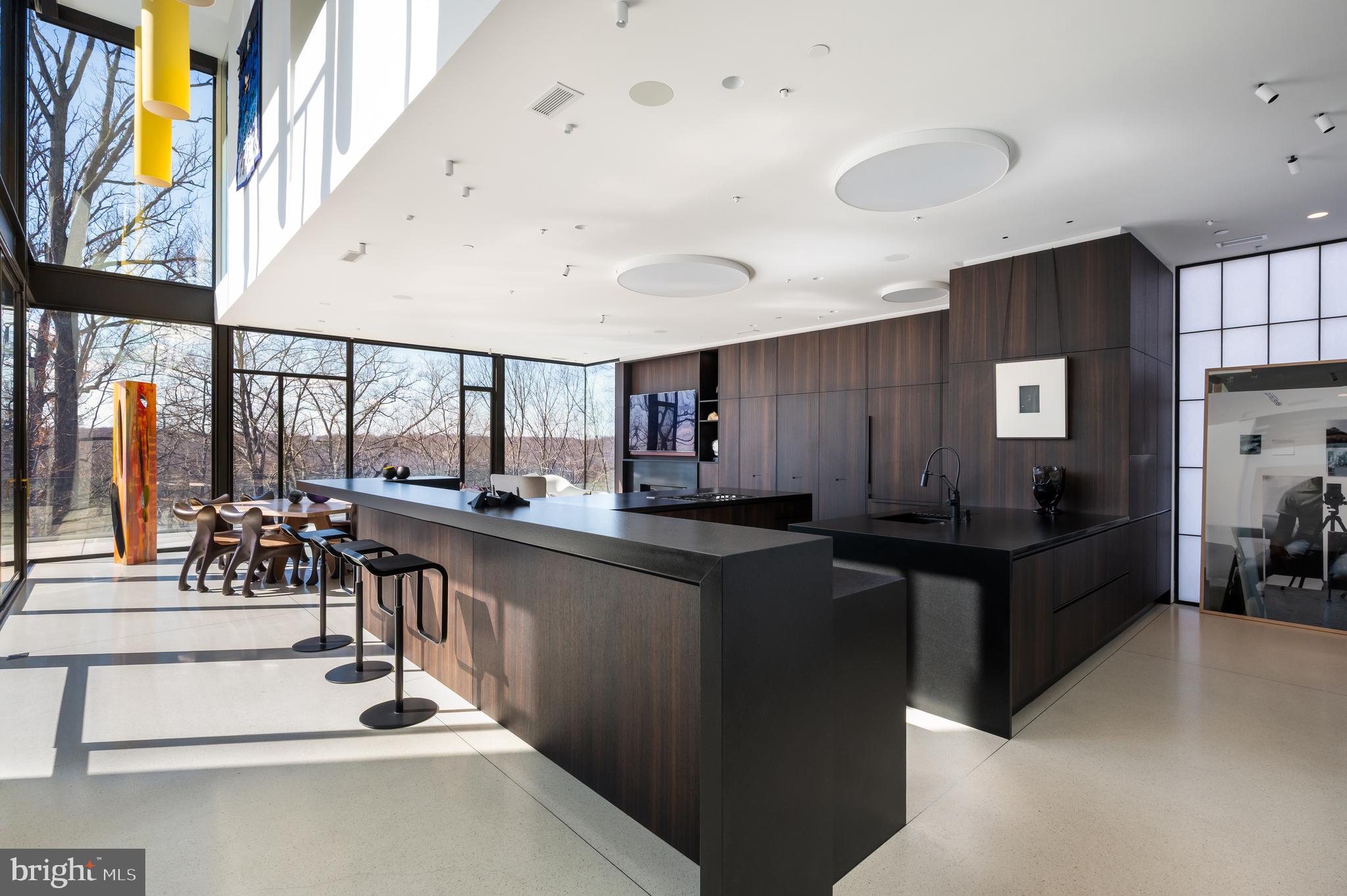 5124 Wissioming Road Bethesda, MD 20816 - Photo 16 of 49 a kitchen with stainless steel appliances kitchen island granite countertop a refrigerator and a stove