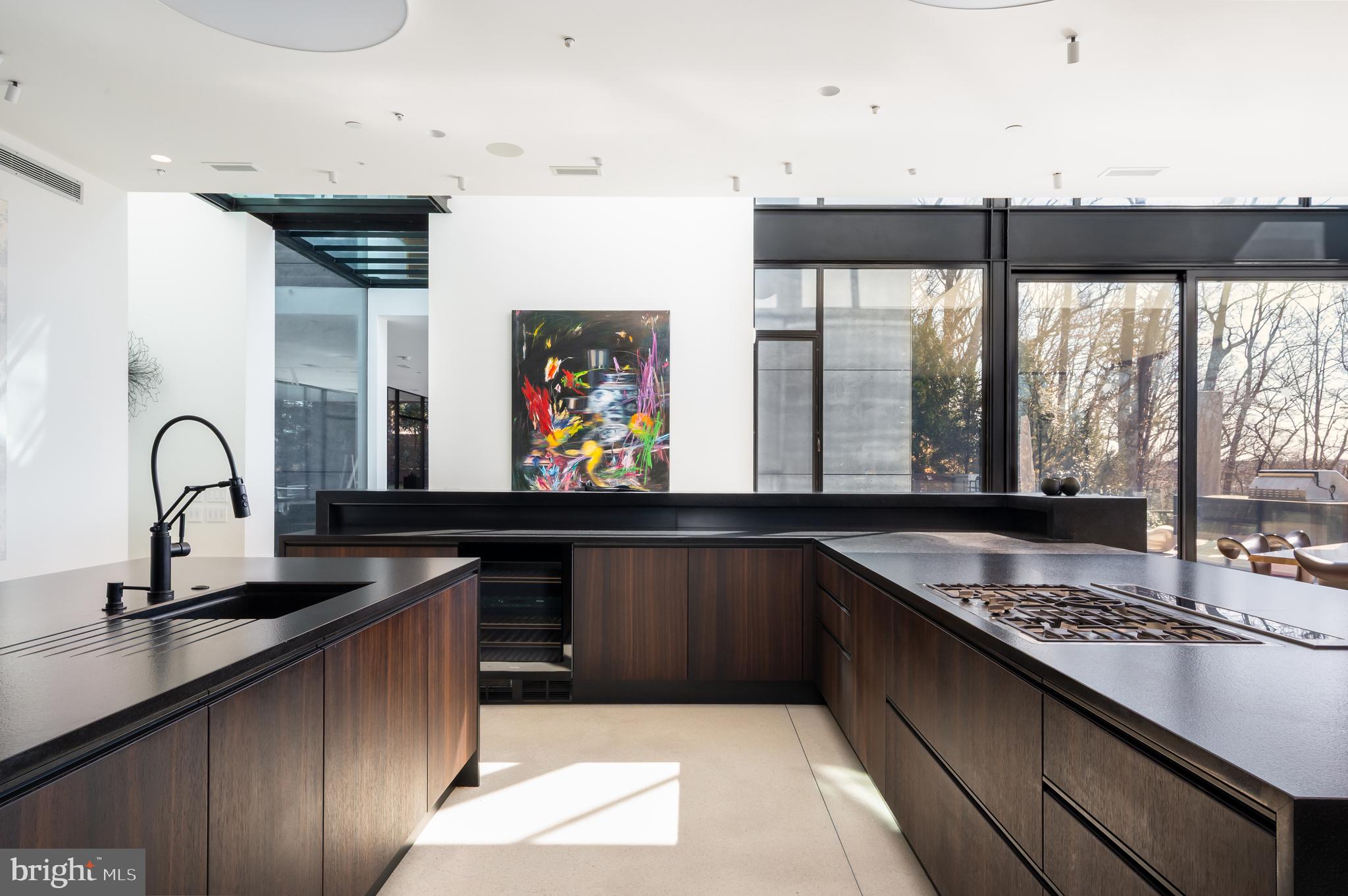 5124 Wissioming Road Bethesda, MD 20816 - Photo 17 of 49 a kitchen with kitchen island a sink appliances and a counter top