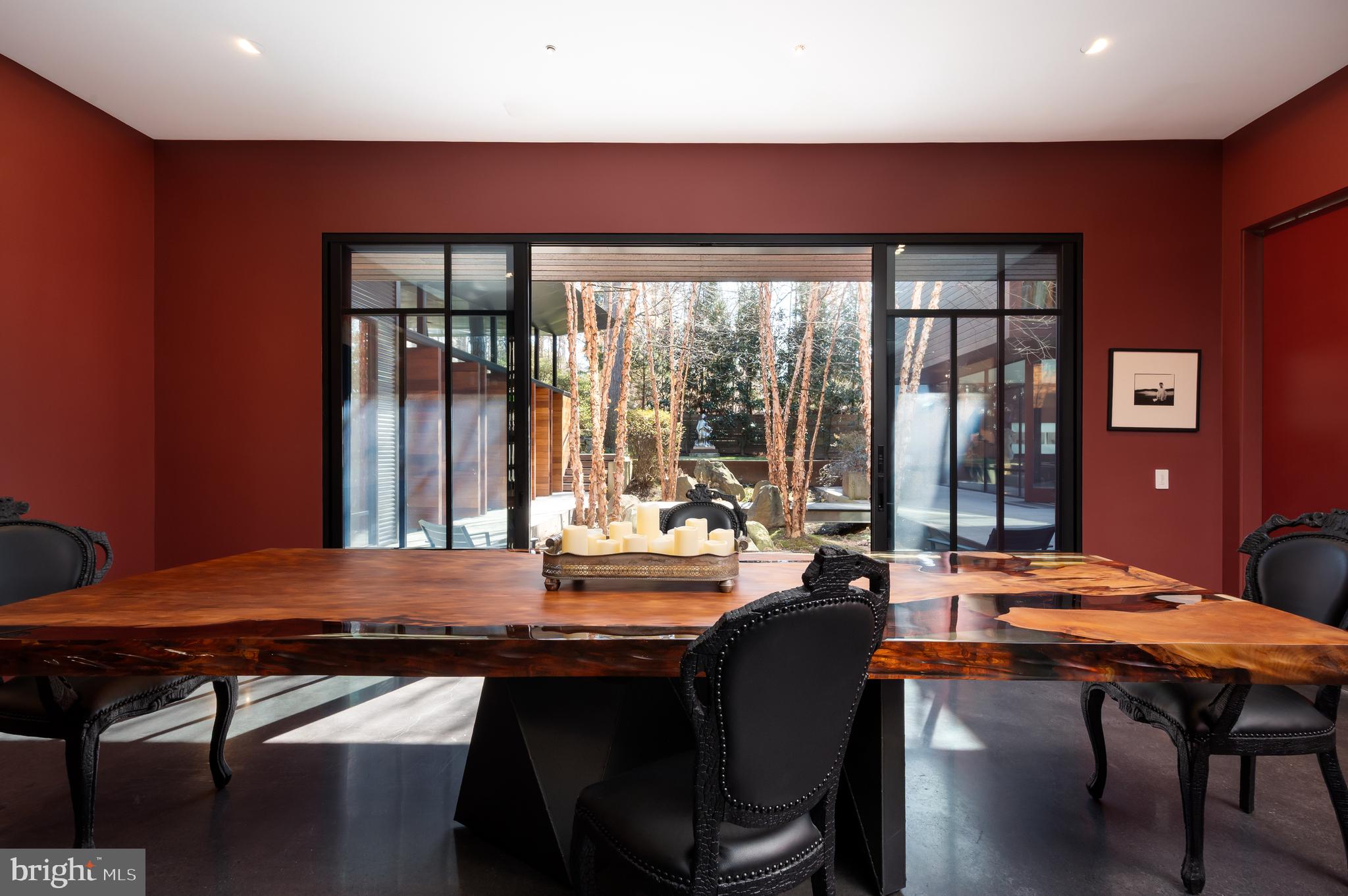 5124 Wissioming Road Bethesda, MD 20816 - Photo 21 of 49 a room with a table chairs and wooden floor
