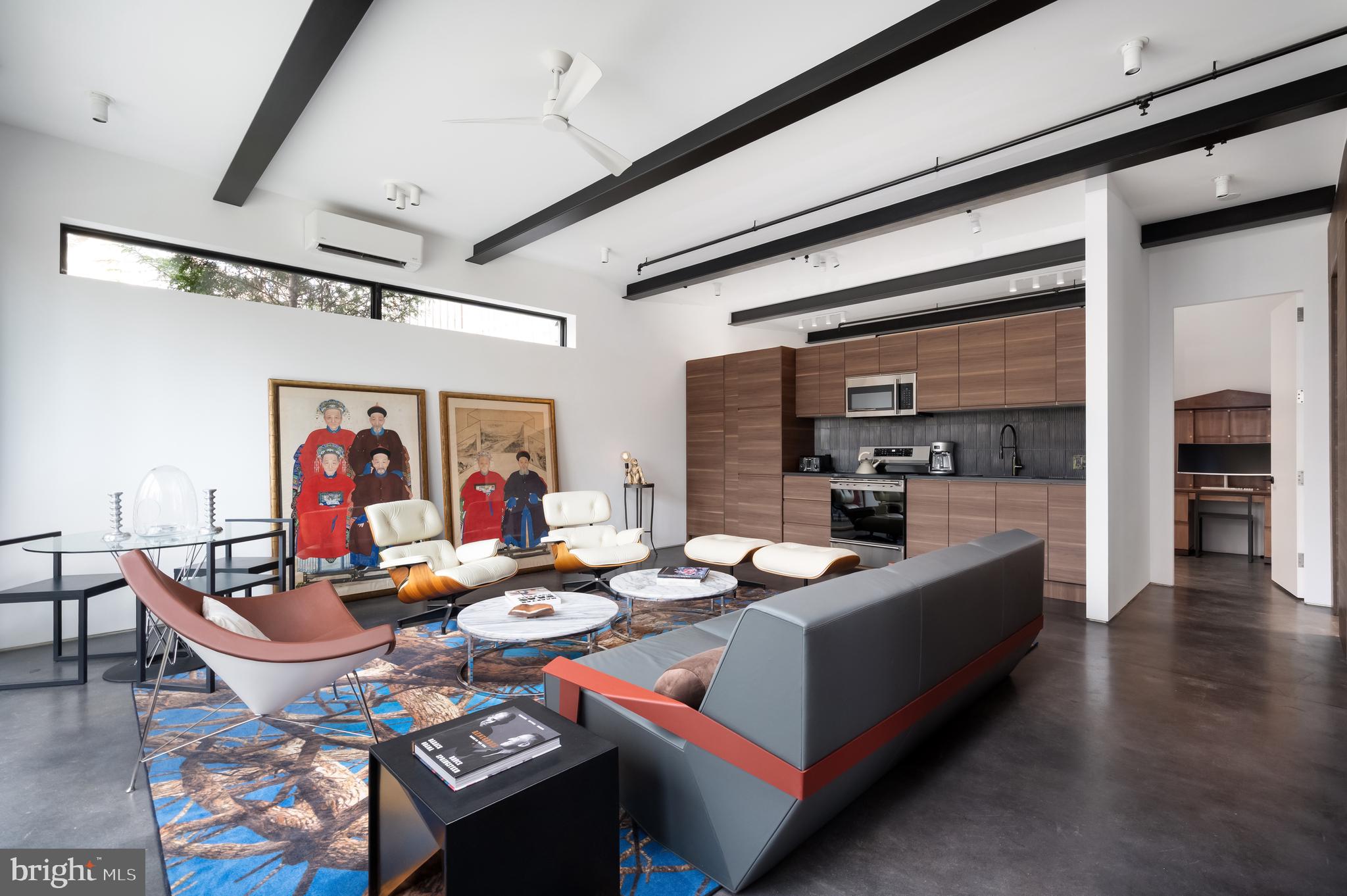 5124 Wissioming Road Bethesda, MD 20816 - Photo 38 of 49 a dining hall with stainless steel appliances kitchen island granite countertop a dining table and chairs with wooden floor