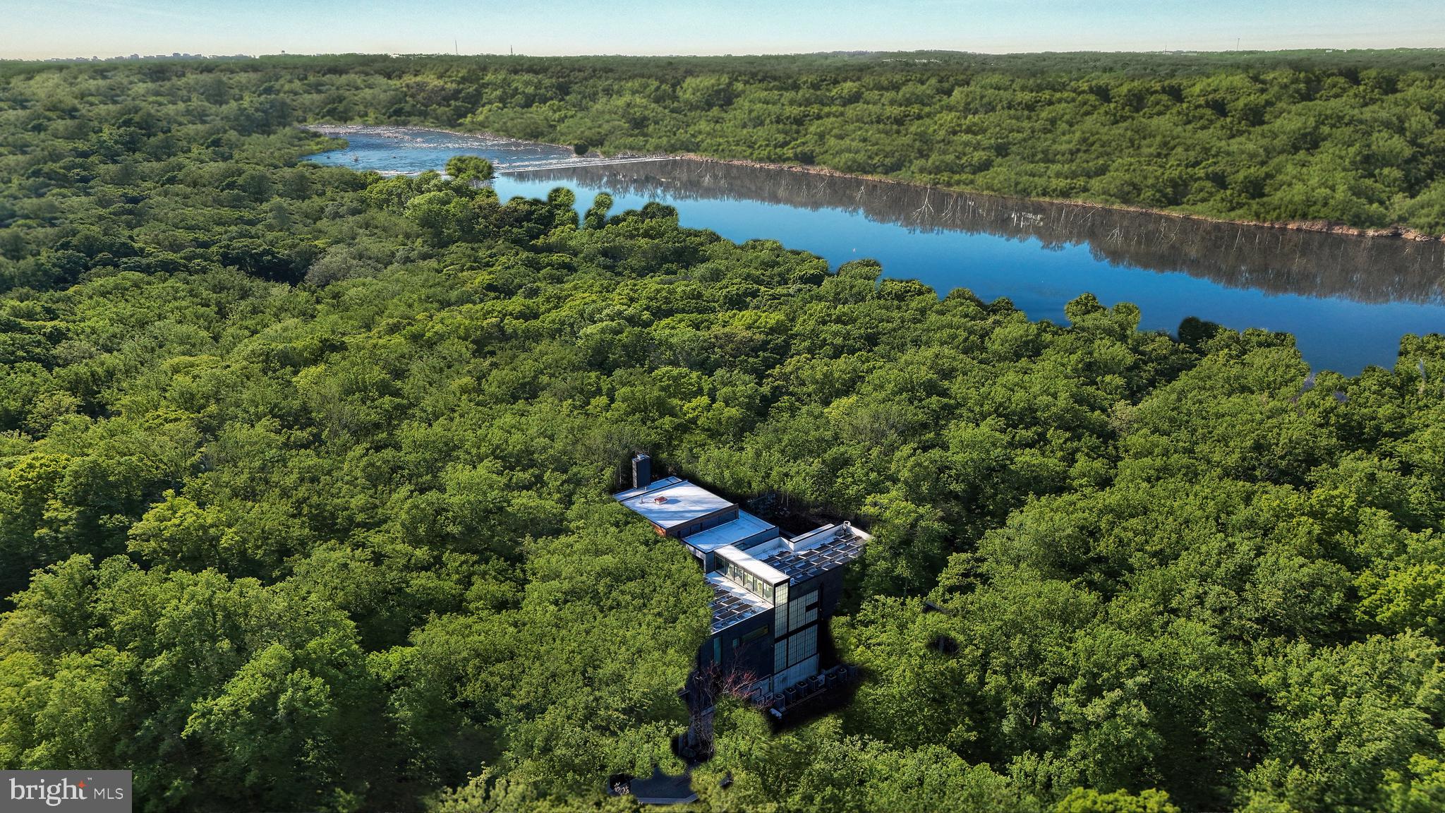 5124 Wissioming Road Bethesda, MD 20816 - Photo 49 of 49 an aerial view of a house with a yard