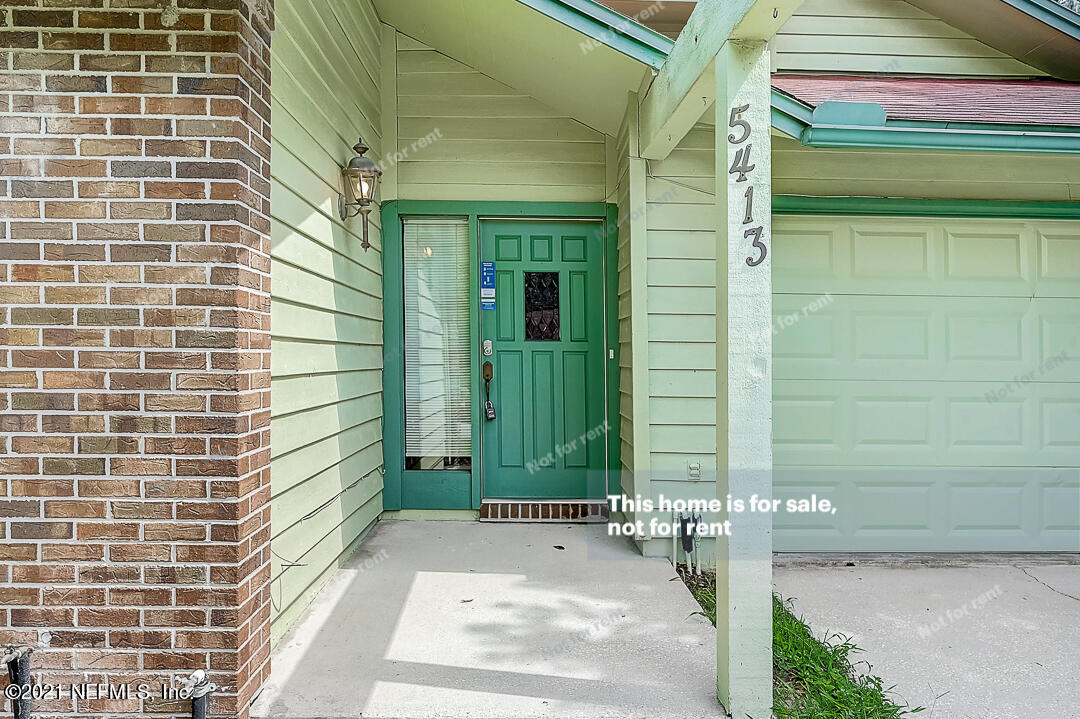 5413 Spring Brook Road Jacksonville, FL 32277 - Photo 10 of 30 a view of a entryway door of the house