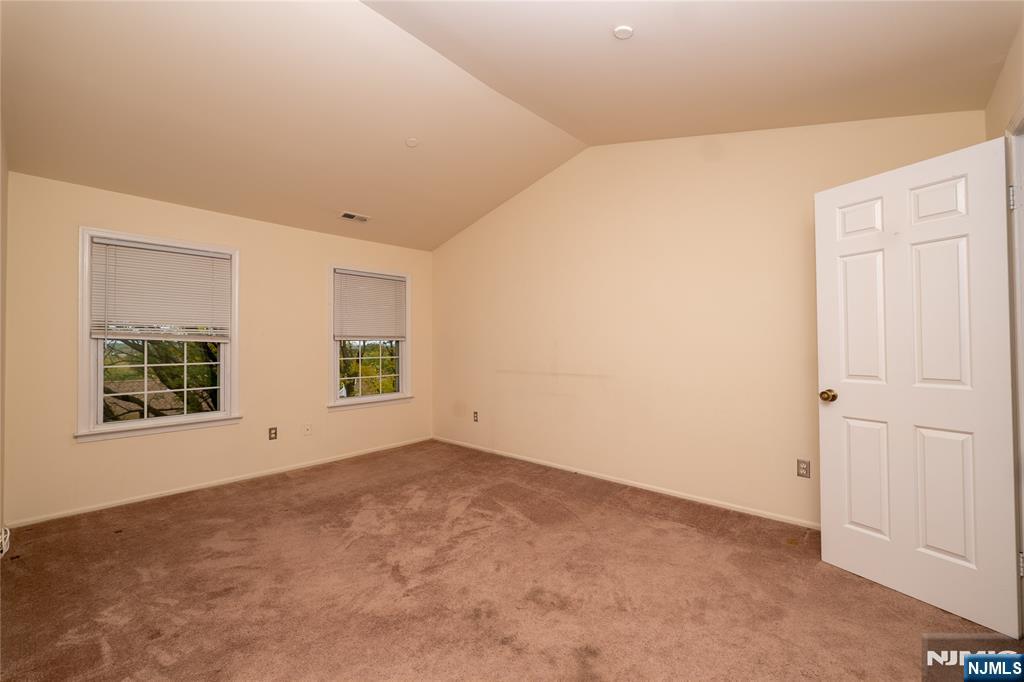56 Fox Run Drive, Unit 56 Englewood, NJ 07631 - Photo 15 of 31 an empty room with windows