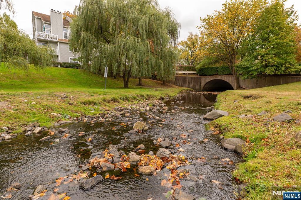 56 Fox Run Drive, Unit 56 Englewood, NJ 07631 - Photo 30 of 31 a view of a yard with plants and trees
