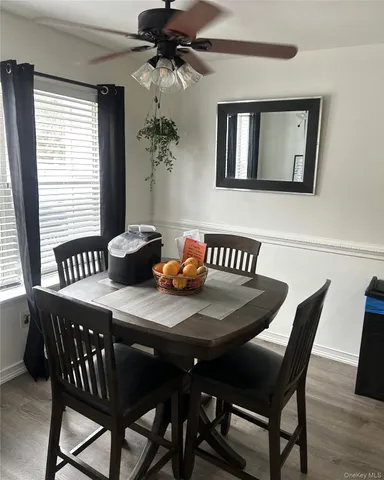 a dining room with furniture and window