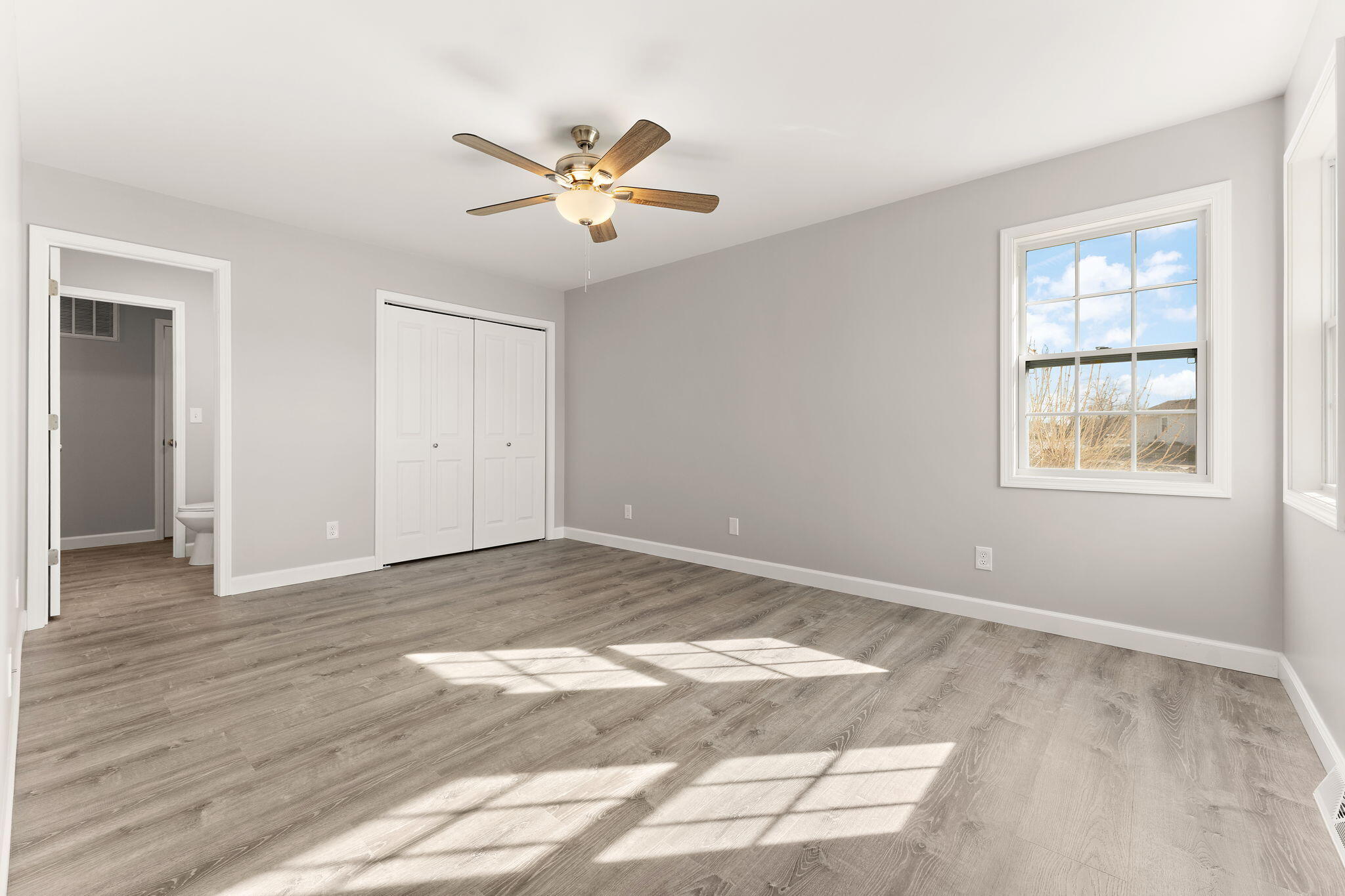 191 Mallard Pointe Drive Valparaiso, IN 46385 - Photo 14 of 25 a view of an empty room with wooden floor and window