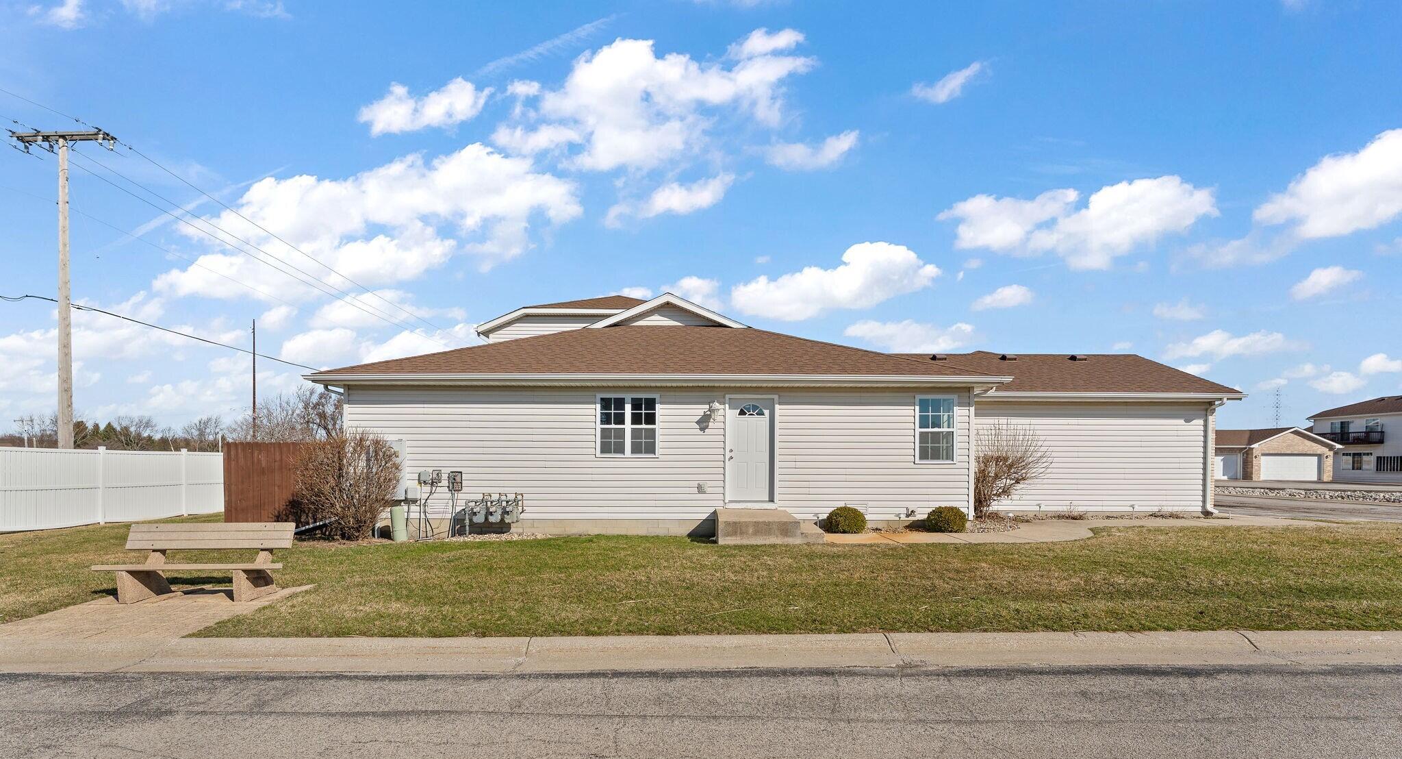 191 Mallard Pointe Drive Valparaiso, IN 46385 - Photo 2 of 25 a view of a white house next to a yard with big trees