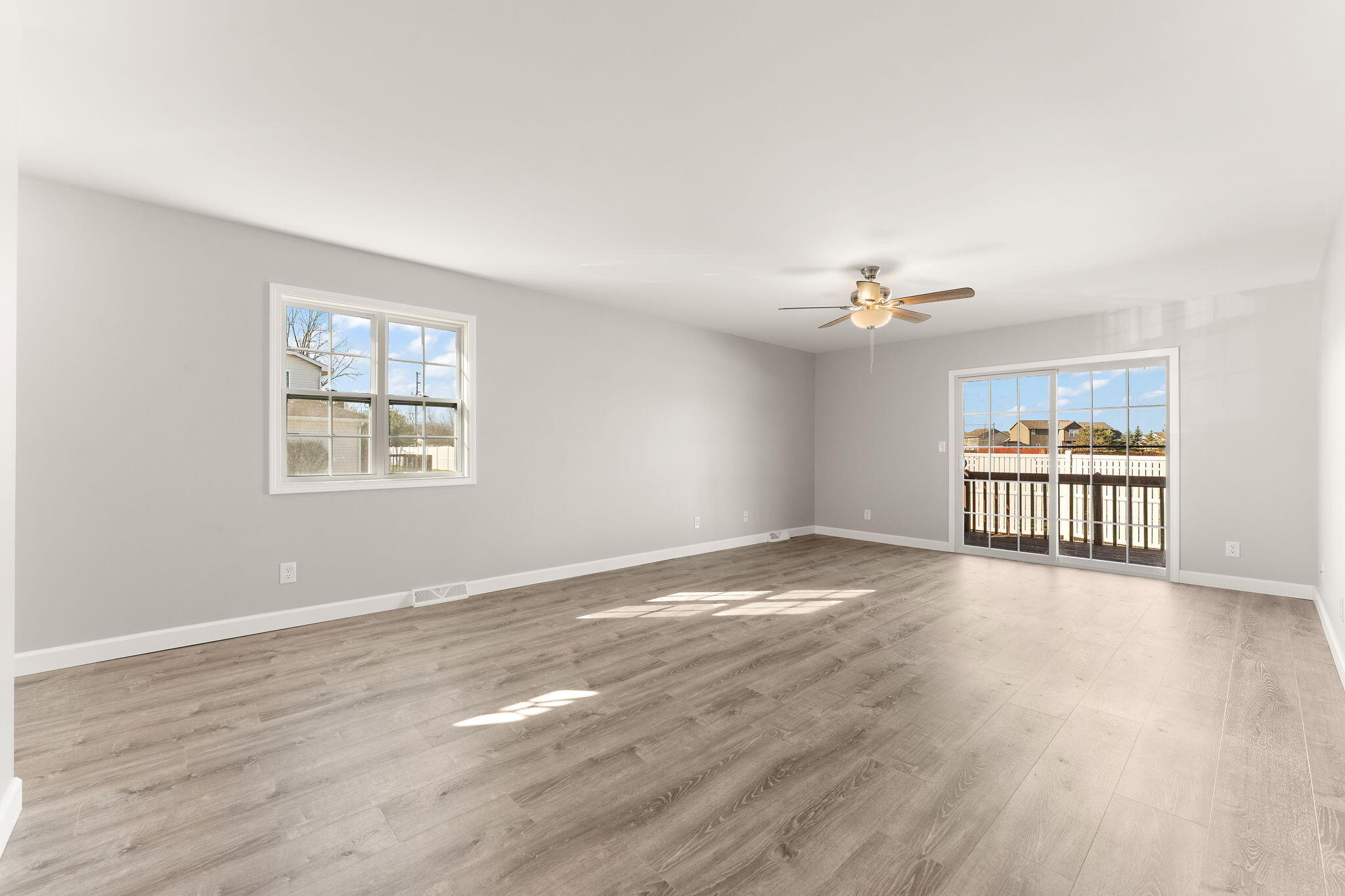 191 Mallard Pointe Drive Valparaiso, IN 46385 - Photo 6 of 25 a view of an empty room with wooden floor and a window