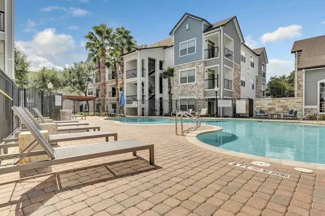 a view of a building with a swimming pool
