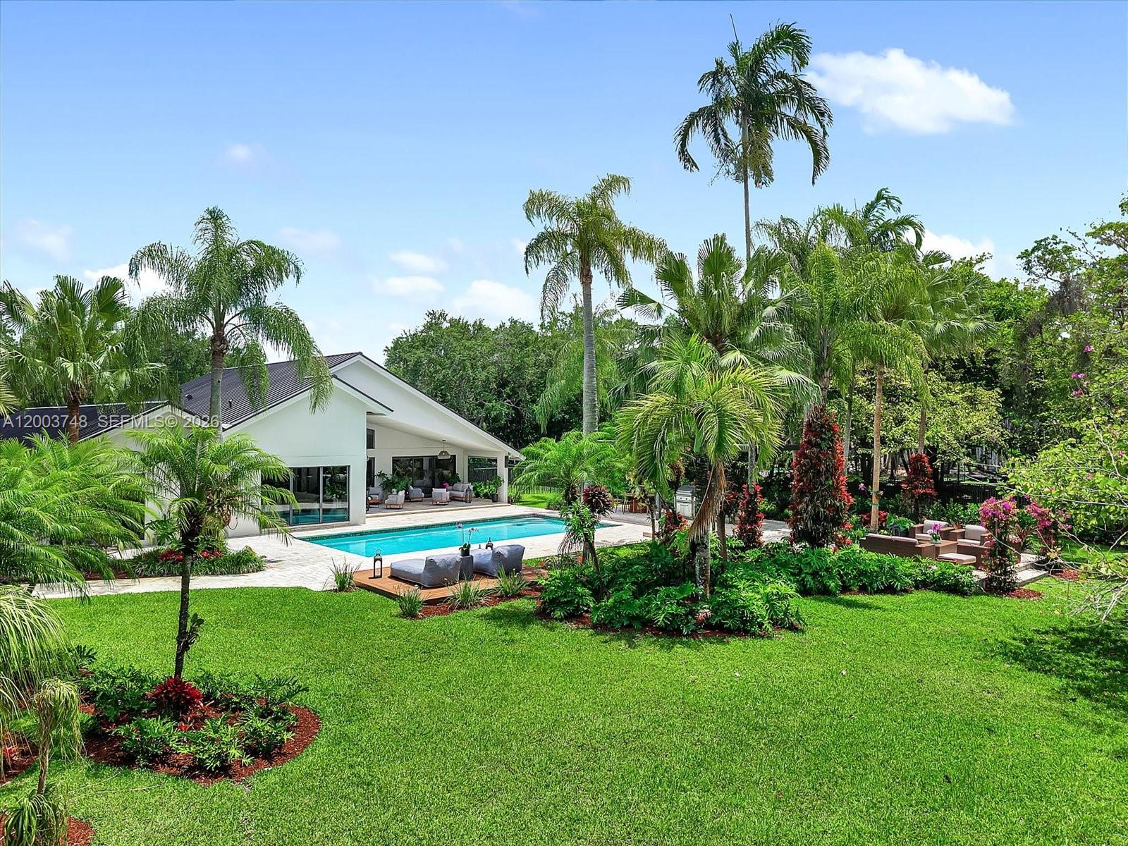 2675 Hackney Road Weston, FL 33331 - Photo 6 of 61 a front view of a house with a yard and potted plants